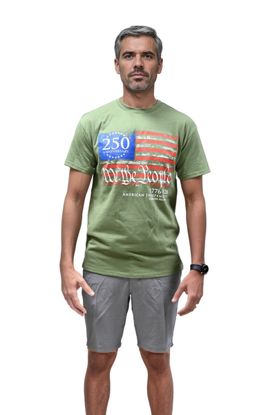 Man wearing a green We The People t-shirt with a graphic design on a plain background